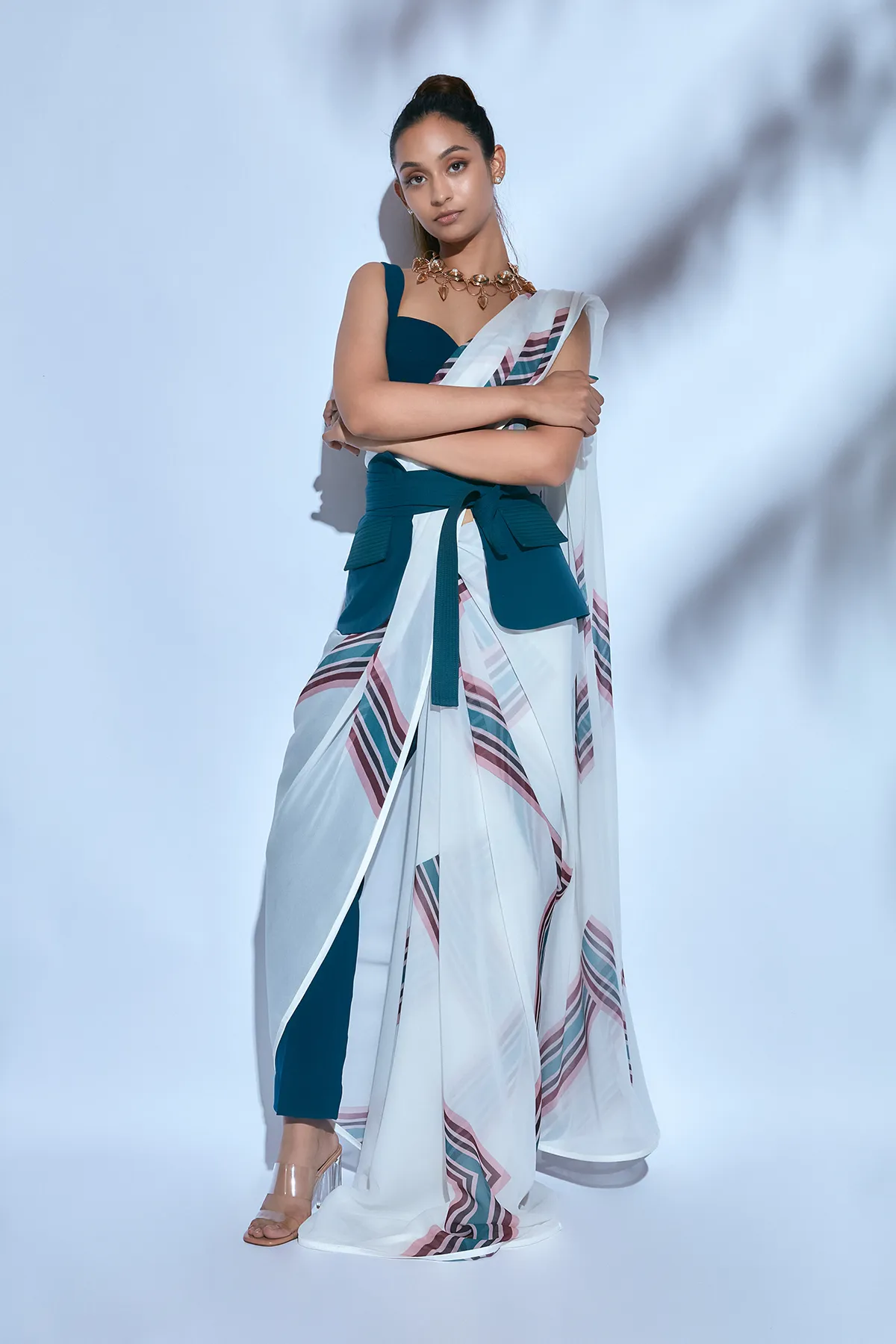 White Printed Sari paired with Teal Blouse